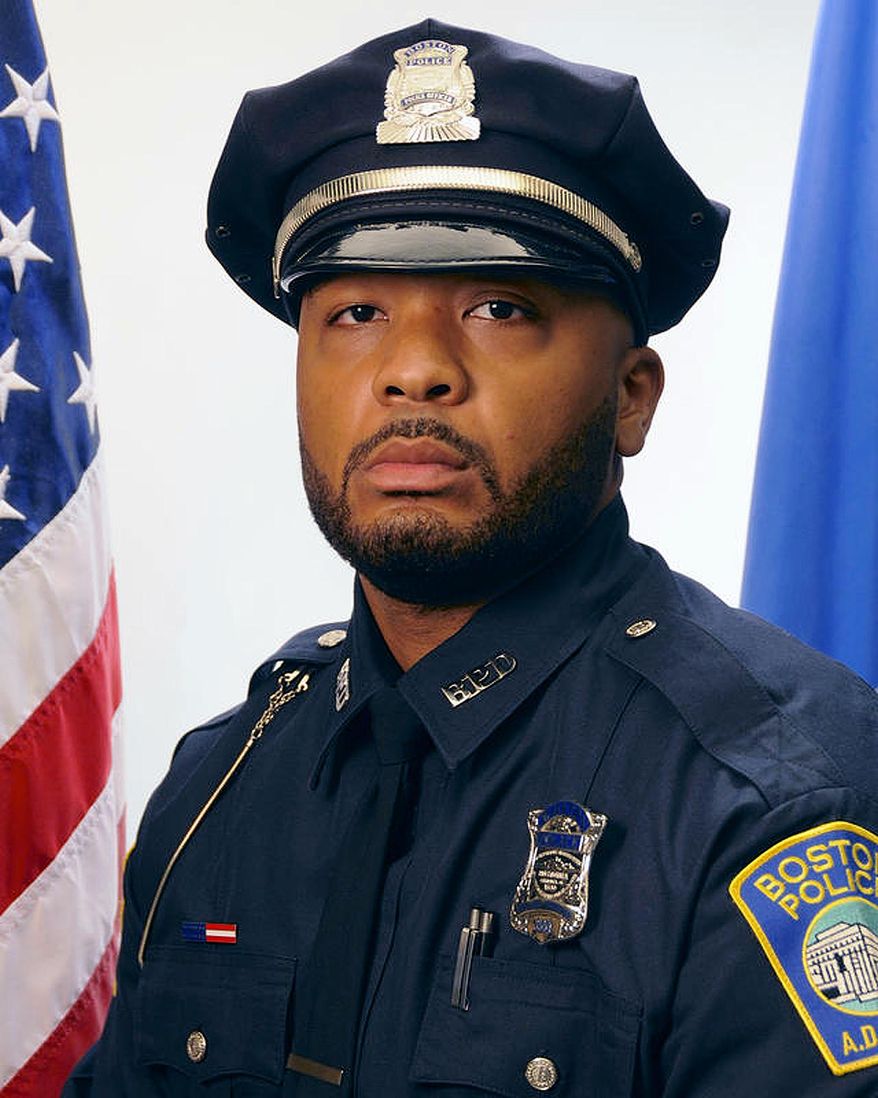 This undated official portrait released by the Boston Police Department shows policer officer Dennis Simmonds, who died on April 10, 2014. Simmonds was among the officers at the scene in Watertown, Mass., in the early hours of April 19, 2013, when the Boston Marathon bombers were engaged in a shootout with police. His death was linked to head injuries he sustained at that time when an explosive thrown by one of the Tsarnaev brothers detonated near him. (Boston Police Department via AP)