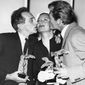 FILE - In this April 8, 1951 file photo, Jean Cocteau, left, and Jean Marais kiss Michele Morgan whilst holding their awards at Cannes Film Festival in France. Michele Morgan, a French actress who starred with Humphrey Bogart and Frank Sinatra and whose sea blue eyes captivated French audiences for decades, has died at 96. (AP Photo/File)