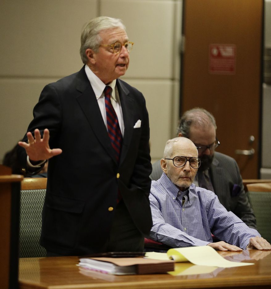 Real estate heir Robert Durst, right, sits in a courtroom as his attorney Dick DeGuerin talks to the judge during a hearing Wednesday, Dec. 21, 2016, in Los Angeles. (AP Photo/Jae C. Hong, Pool)