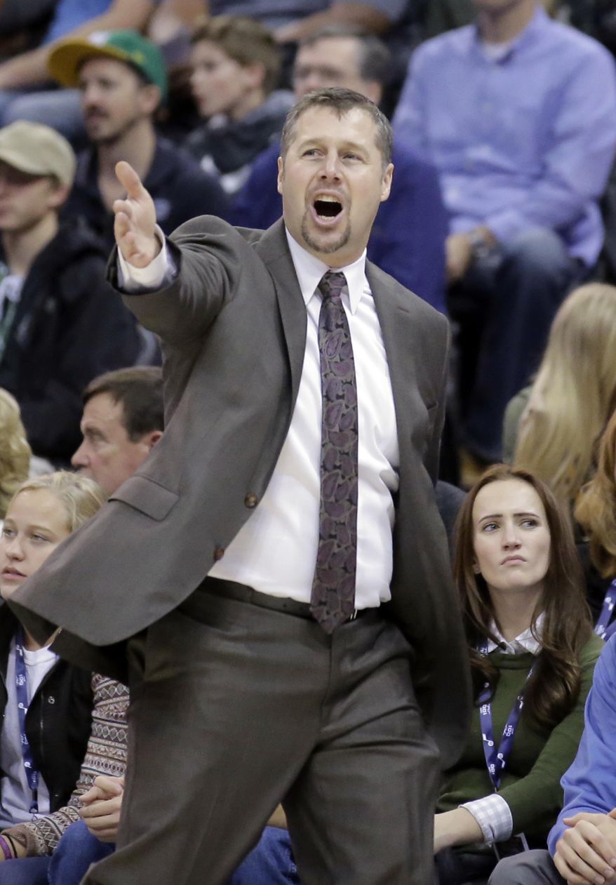 Sacramento Kings head coach David Joerger shouts to his team in the first half during an NBA basketball game against the Utah Jazz Wednesday, Dec. 21, 2016, in Salt Lake City. (AP Photo/Rick Bowmer)