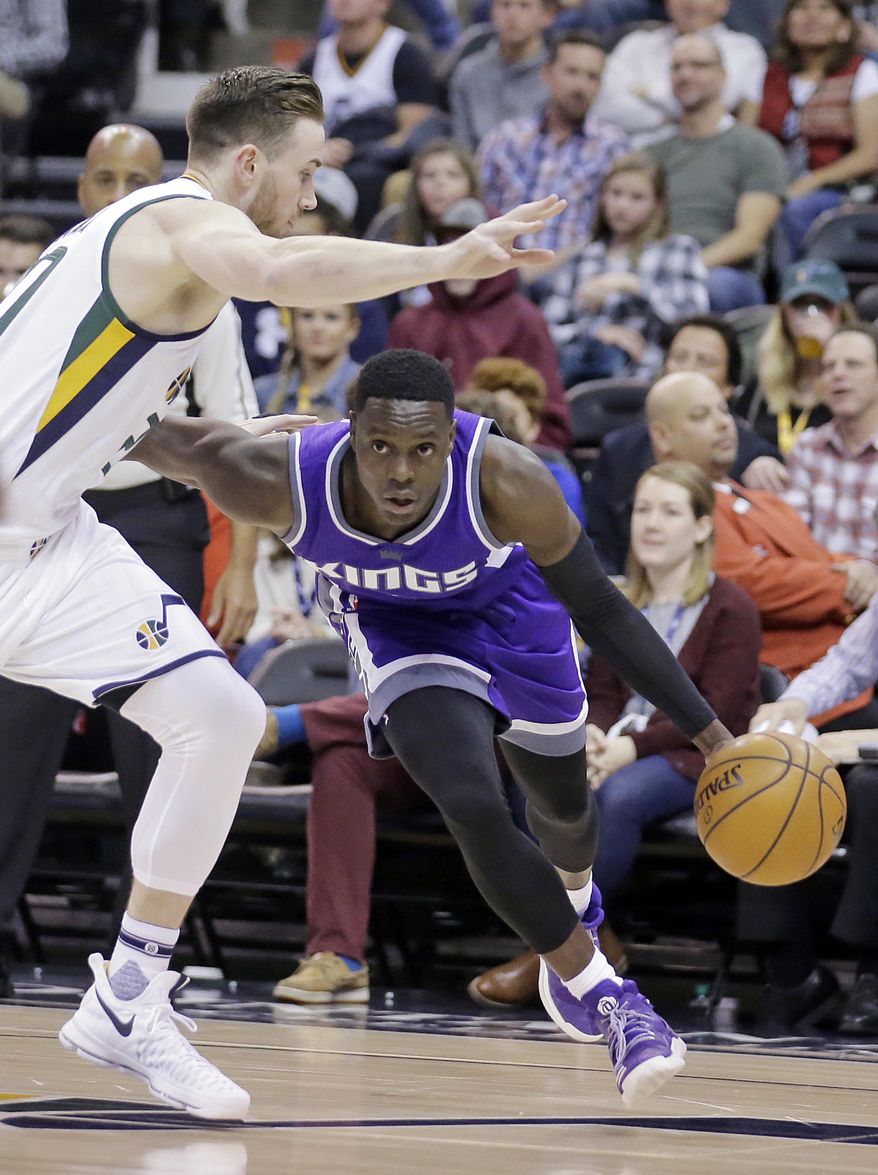 Sacramento Kings guard Darren Collison, right, drives to the basket as Utah Jazz forward Gordon Hayward, left, defends in the first half during an NBA basketball game Wednesday, Dec. 21, 2016, in Salt Lake City. (AP Photo/Rick Bowmer)