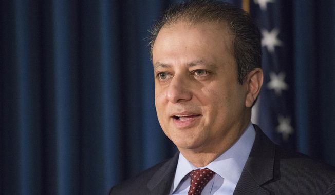 United States District Attorney Preet Bharara announces charges, Wednesday, Dec. 21, 2016 in New York. (AP Photo/Mark Lennihan)