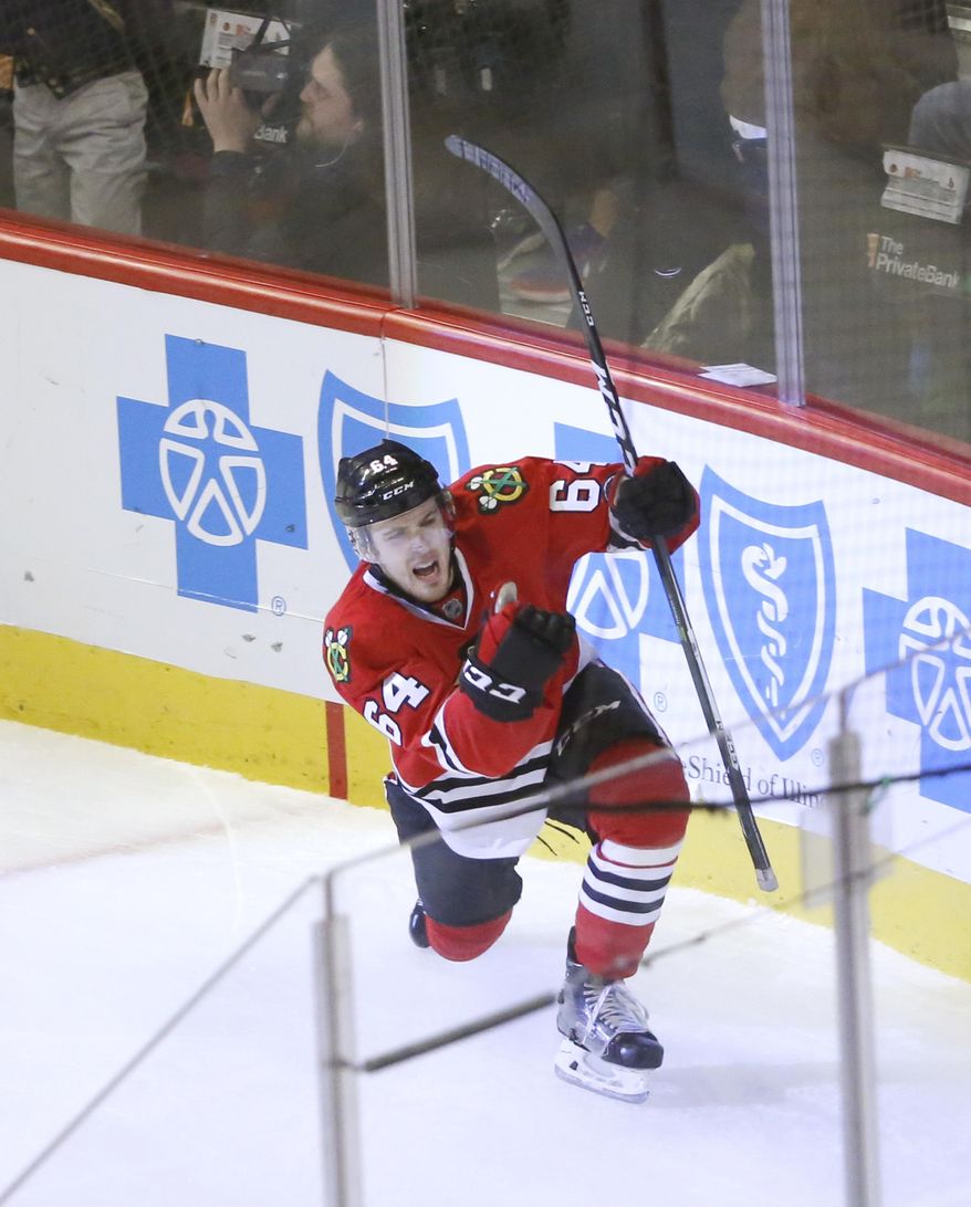 Chicago Blackhawks' Tyler Motte celebrates his goal during the second period of an NHL hockey game against the Ottawa Senators Tuesday, Dec. 20, 2016, in Chicago. (AP Photo/Charles Rex Arbogast)