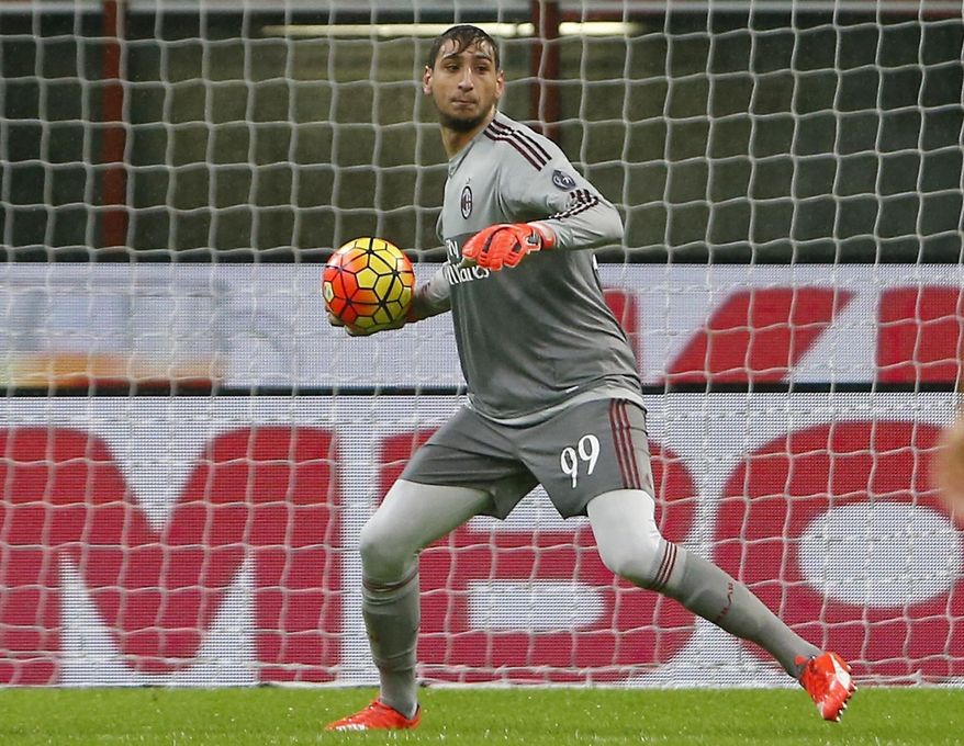FILE - In this Wednesday, Oct. 28, 2015 file photo, AC Milan goalkeeper Gianluigi Donnarumma gets the ball during the Serie A soccer match between AC Milan and Chievo at the San Siro stadium in Milan, Italy. Defending champions Juventus will play AC Milan for the Italian Super Cup in Doha on Friday, Dec. 23, 2016. (AP Photo/Antonio Calanni, File)