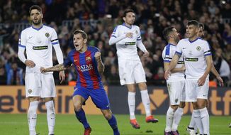 FC Barcelona&#39;s Lucas Digne, second left, reacts after scoring during the Copa del Rey, Spain&#39;s King&#39;s Cup soccer match between FC Barcelona and Hercules at the Camp Nou in Barcelona, Spain, Wednesday, Dec. 21, 2016. (AP Photo/Manu Fernandez)