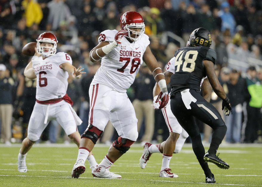FILE - In this Nov. 14, 2015, file photo, Oklahoma offensive tackle Orlando Brown (78) keeps Baylor's Travon Blanchard (48) away from quarterback Baker Mayfield during an NCAA college football game in Waco, Texas. Orlando "Zeus" Brown Jr. is a second team All-American who hasn't allowed a sack all season. The son of former NFL lineman Orlando Brown will be tested when the seventh-ranked Sooners face No. 17 Auburn in the Sugar Bowl on Jan. 2. (AP Photo/Tony Gutierrez, File)