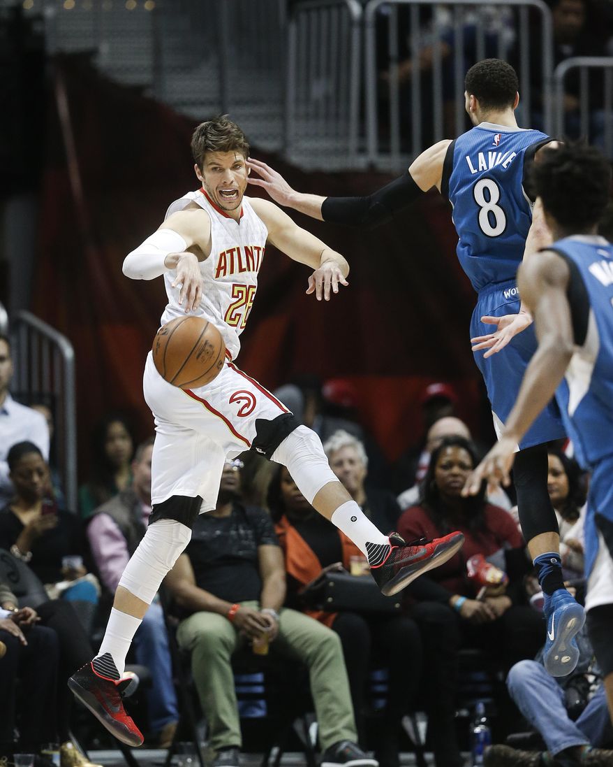 Atlanta Hawks guard Kyle Korver (26) has the ball knocked away by Minnesota Timberwolves guard Zach LaVine (8) in the second half of an NBA basketball game Wednesday, Dec. 21, 2016, in Atlanta. Minnesota won 92-84. (AP Photo/John Bazemore)