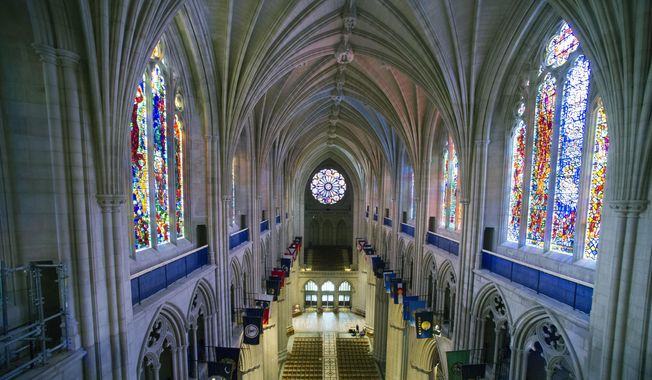 This Wednesday, Feb. 18, 2015, file photo shows the nave of the Washington National Cathedral in Washington. (AP Photo/Cliff Owen)