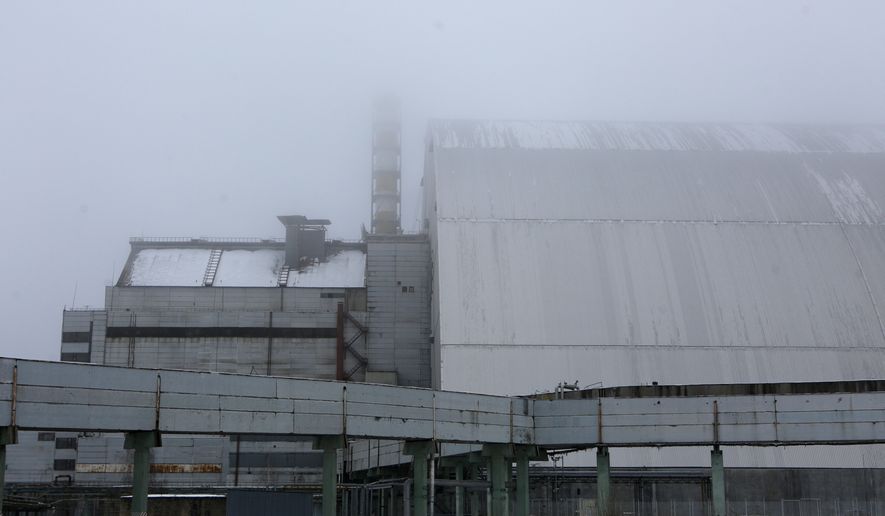A view of a new shelter installed over the exploded reactor at the Chernobyl nuclear plant, Chernobyl, in Chernobyl, Ukraine, Thursday, Dec. 22, 2016. (AP Photo/Sergei Chuzavkov)