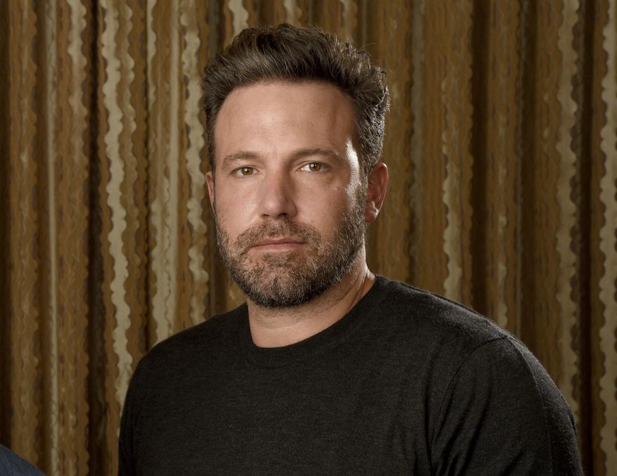 FILE - In this Sept. 30, 2016 photo, Ben Affleck poses at The Four Seasons Hotel in Los Angeles. Affleck is hoping to flip the script again. In between “Batman” movies, he’s releasing his directorial follow-up to his Oscar-winning “Argo”: “Live By Night,” adapted from Dennis Lehane’s crime novel about a Prohibition era-gangster (Affleck) who decamps from Boston to Ybor City, Florida, to create a rum-running empire.  (Photo by Chris Pizzello/Invision/AP, File)