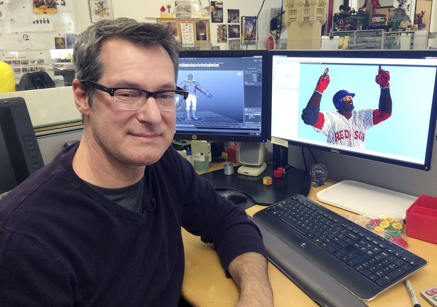 n this Monday, Dec. 19, 2016 photo, Lego master model builder Erik Varszegi sits at his computer at the company office in Enfield, Conn. The builders use computer software to create models that can take 70 to 150 hours to design and 350 hours to build for full-size characters. (AP Photo/Michael Melia)