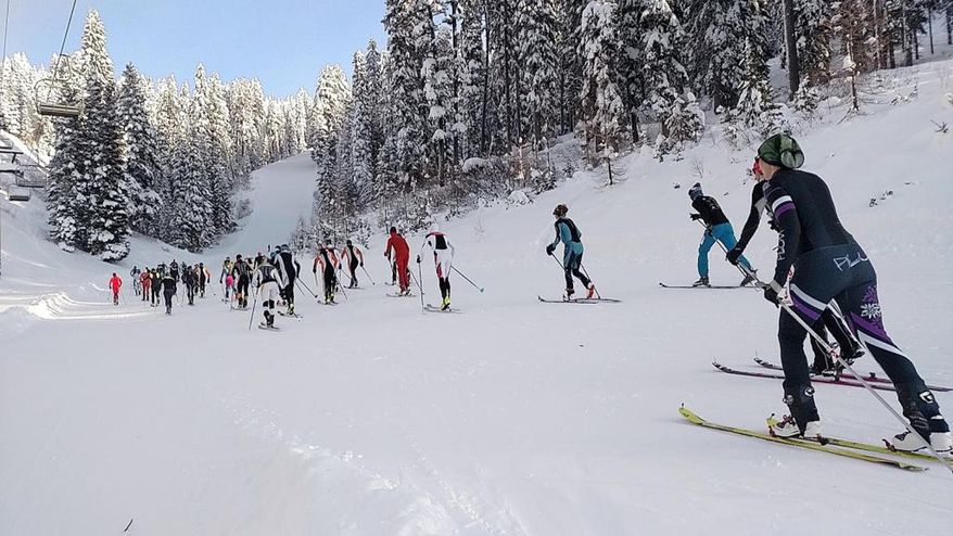 In this Dec. 16, 2016 photo, ski mountaineering racers make their way up the 45th Parallel run during the Northwest Passage Ski Mountaineering Vertical Race at Brundage Ski resort in McCall, Idaho. The vertical race featured a sprint to the top of the mountain that included 530 meters of elevation gain. (Kyle Green/Idaho Statesman via AP)