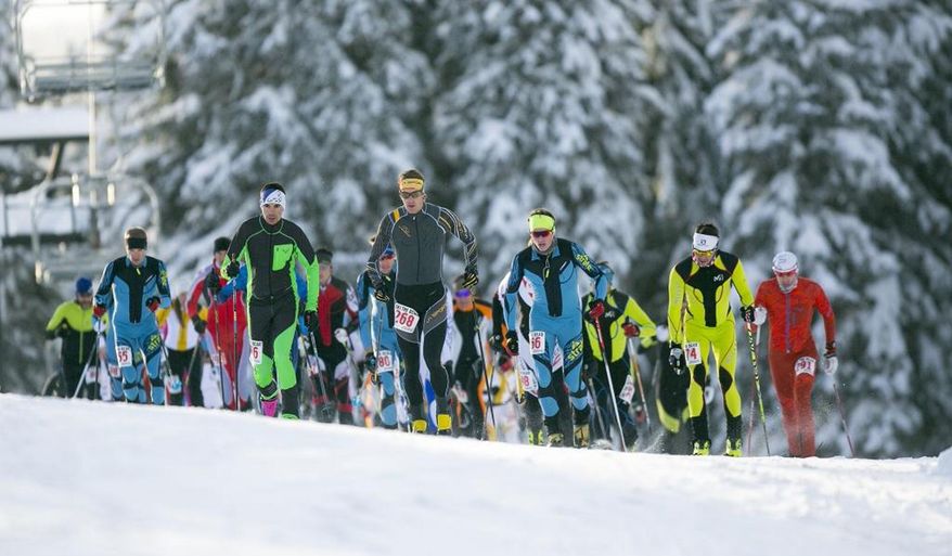 ADVANCE FOR WEEKEND EDITIONS, DEC. 24-25 - In this Dec. 16, 2016 photo, ski mountaineering racers make their way up the 45th Parallel run during the Northwest Passage Ski Mountaineering Vertical Race at Brundage Ski resort in McCall, Idaho. The vertical race featured a sprint to the top of the mountain that included 530 meters of elevation gain. (Kyle Green/Idaho Statesman via AP)