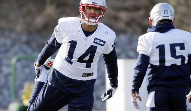 New England Patriots wide receiver Michael Floyd (14) stretches during an NFL football team practice Wednesday, Dec. 21, 2016, in Foxborough, Mass. (AP Photo/Elise Amendola)