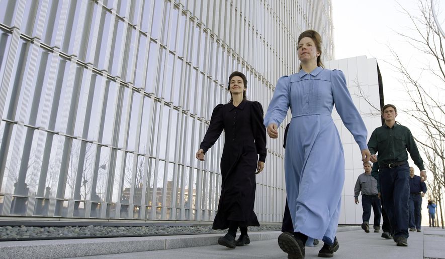FILE - In this April 6, 2016, file photo, Fundamentalist Church of Jesus Christ of Latter-Day Saints women leave the Federal Courthouse following a hearing in Salt Lake City. Utah polygamous group leader John Wayman, charged in a multimillion dollar food-stamp fraud case, agreed to a plea deal in Salt Lake City on Thursday, Dec. 22, that secures his release from jail after six months. (AP Photo/Rick Bowmer, File)