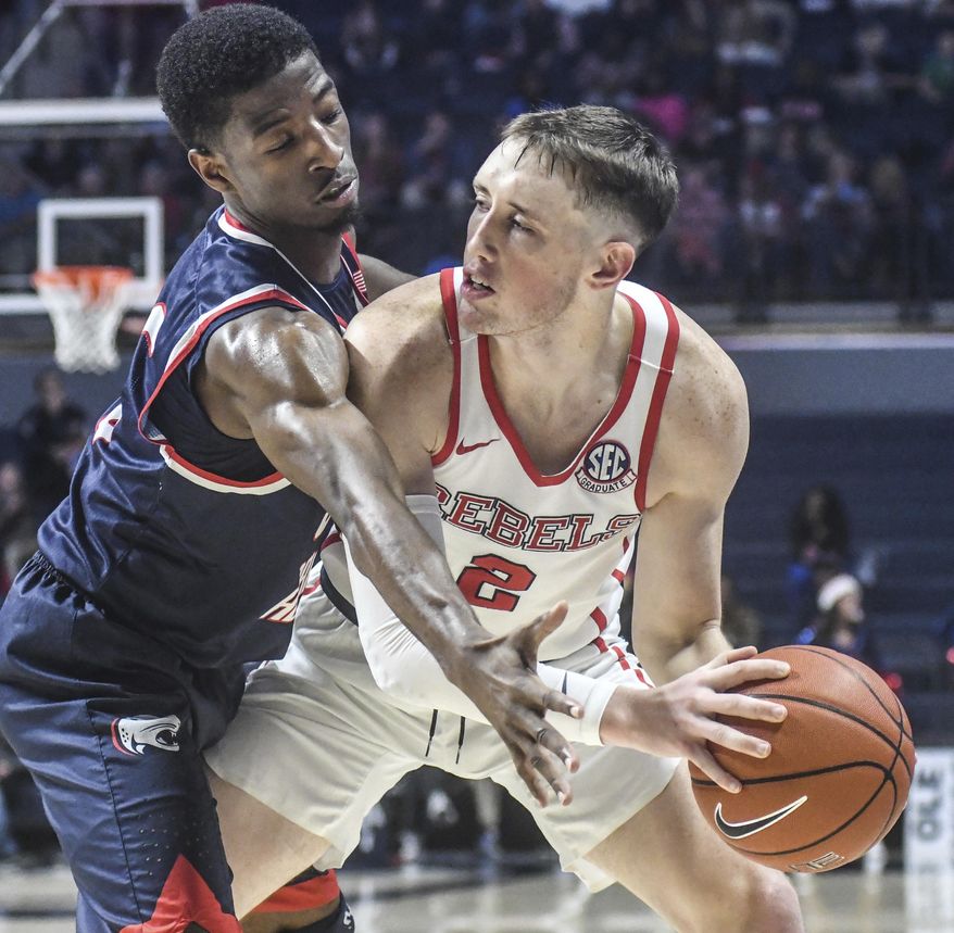 Mississippi guard Cullen Neal (2) is defended by South Alabama guard Dederick Lee (5) during an NCAA college basketball game Thursday, Dec. 22, 2016, in Oxford, Miss. (Bruce Newman/Oxford Eagle via AP)