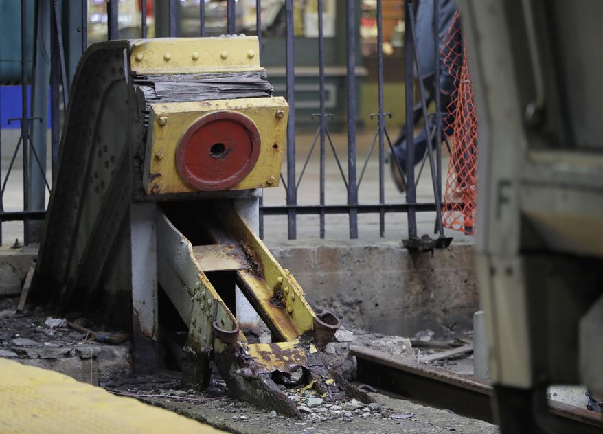 This photograph taken Wednesday, Nov. 30, 2016, shows a bumping post on Track 12 at the Hoboken Train Terminal in Hoboken, N.J. Only one of the terminal's tracks features a modern bumping post. The post on Track 15 is the only post featuring a modern post designated to stop a runaway train. The other posts were installed more than 100 years ago and recently became relevant in the wake of the New Jersey Transit train crash that occurred Sept. 29, 2016. (AP Photo/Julio Cortez)