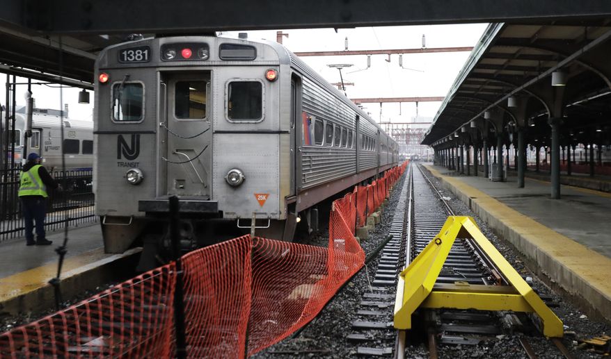 In a photograph taken Wednesday, Nov. 30, 2016, a bumping post, right, sits on Track 15 at the Hoboken Train Terminal in Hoboken, N.J. The post on Track 15 is the only post, which features a modern post designated to stop a runaway train. The other posts were installed more than 100 years ago and recently became relevant in the wake of the New Jersey Transit train crash that occurred Sept. 29, 2016. (AP Photo/Julio Cortez)