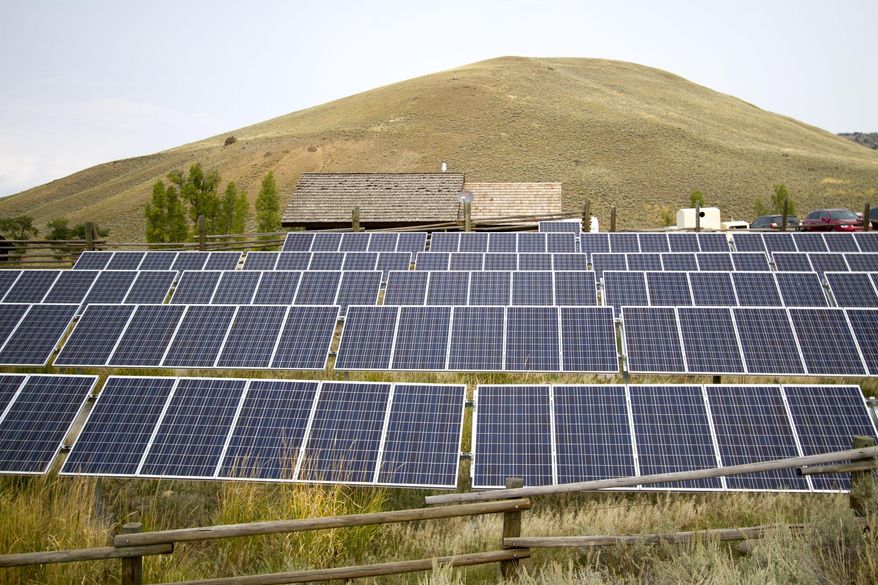 FILE - This Aug. 27, 2015, file photo shows a solar power array that is part of sustainability improvements at the Lamar Buffalo Ranch in Yellowstone National Park, Wyo. Renewable energy developers say they're hopeful about the future despite President-elect Donald Trump's promise to bring coal mining jobs back. In recent years, huge solar and wind farms have sprouted up on public desert land in the Western United States buoyed by generous federal tax credits. (Ryan Jones /Jackson Hole News & Guide via AP, File)
