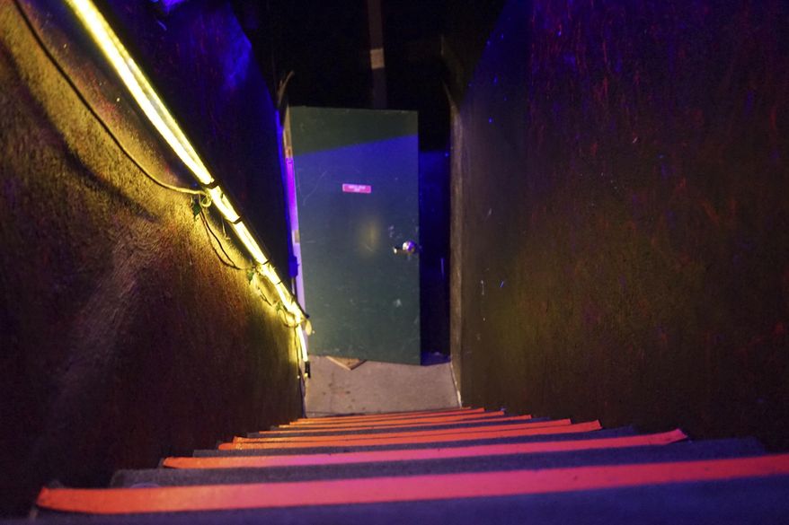 This Dec. 19, 2016 photo shows an interior exit stairway at an underground music club known as known as Purple 33 in a Playa Vista neighborhood of Los Angeles. About a week after 36 people died in a fire at an underground music party in Oakland, inspectors acting on a complaint discovered a makeshift nightclub and unpermitted living quarters concealed in a warehouse near Los Angeles International Airport. After the deadly fire, officials in LA, Baltimore and other cities announced plans to aggressively pursue illegally converted warehouses and other jerry-rigged living spaces. (AP Photo/Christine Armario)