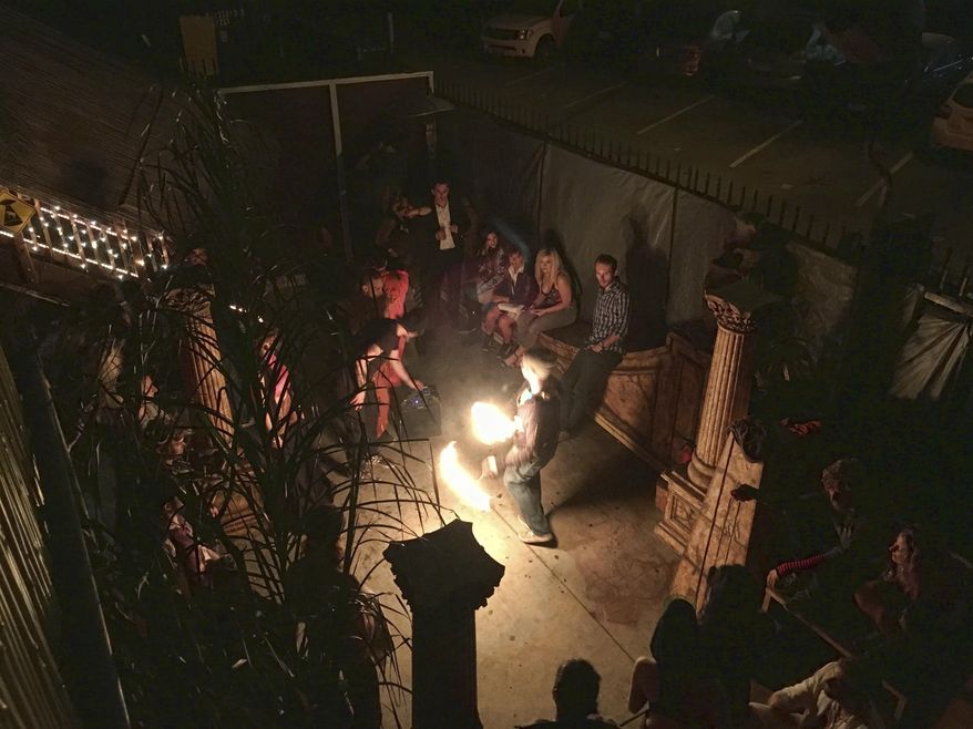 This Nov. 1, 2016, photo provided by David Coons shows a fire dance performance in an underground music club known as known as Purple 33 in a Playa Vista neighborhood of Los Angeles. About a week after 36 people died in a fire at an underground music party in Oakland, inspectors acting on a complaint discovered a makeshift nightclub and unpermitted living quarters concealed in a warehouse near Los Angeles International Airport. (David Coons via AP)