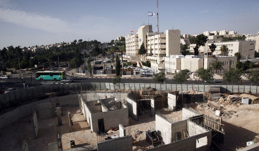 This May 17, 2016, file photo shows construction on land owned by Palestinian Mohammad Abu Ta&#39;a, in east Jerusalem. Abu Ta&#39;a discovered some years ago that the Israeli government had expropriated the piece of land in Jerusalem belonging to his family and handed it over to a leading organization that oversees Jewish settlement building in the West Bank. (AP Photo/Mahmoud Illean) ** FILE **