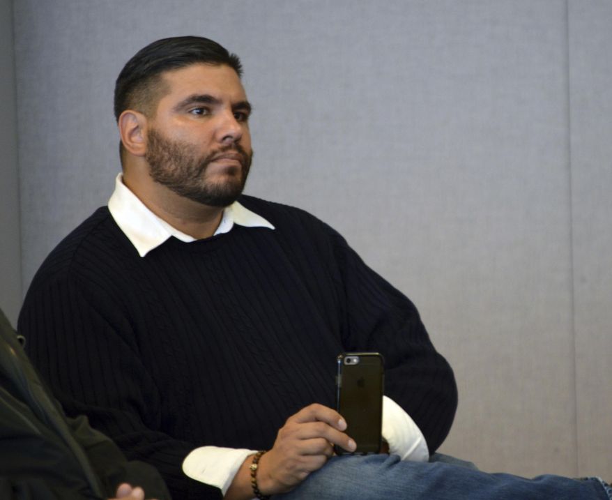 In this Tuesday, Dec. 20, 2016, Javier Benavidez, executive director of the advocacy group SouthWest Organizing Project, listens to anti-poverty advocates at a press conference in Albuquerque, N.M. The Albuquerque activist had helped organize two anti-Donald Trump protests in New Mexico and said he looked to the experience of veterans of the Civil Rights Movements to handle the disappointment of Trump's election victory. (AP Photo/Russell Contreras)