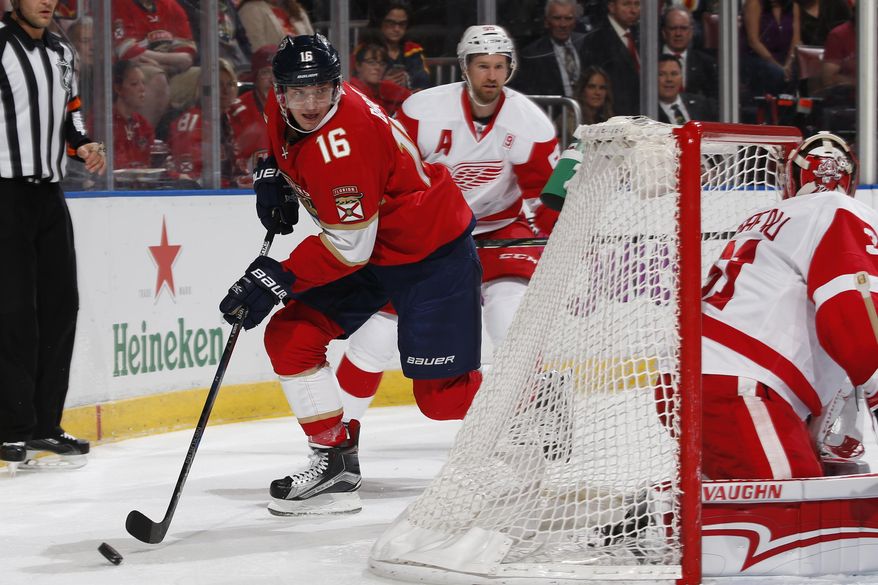 Florida Panthers center Aleksander Barkov (16) attempts to pass the puck in front of the Detroit Red Wing net during the first period of an NHL hockey game, Friday, Dec. 23, 2016, in Sunrise, Fla. (AP Photo/Joel Auerbach)
