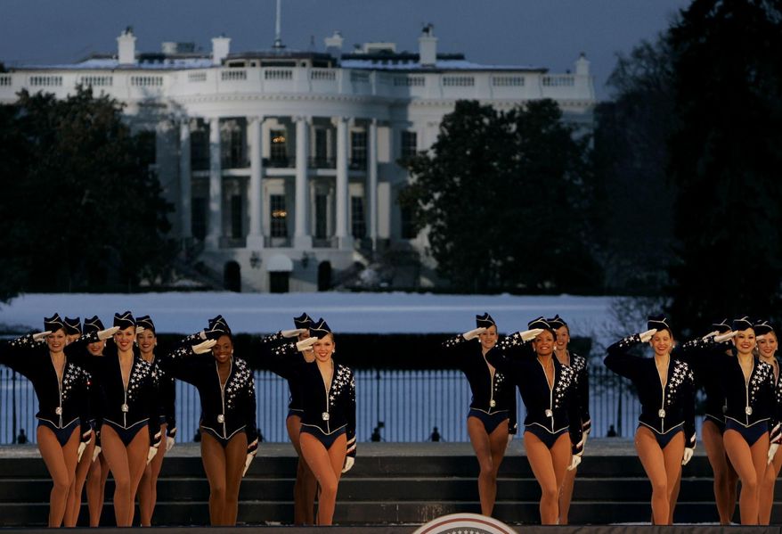 In this Wednesday, Jan. 19, 2005, file photo, the Rockettes perform during the Celebration of Freedom Concert on the Ellipse, with the White House in the background in Washington. The Radio City Rockettes have been assigned to dance at President-elect Donald Trump’s inauguration January 2017. (AP Photo/Chris Gardner, File)