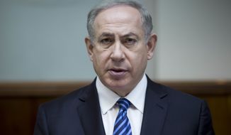 In this Dec. 11, 2016, photo, Israeli Prime Minister Benjamin Netanyahu attends the weekly cabinet meeting at his office in Jerusalem. Netanyahu lashed out at President Barack Obama on Saturday, Dec. 24, accusing him of a &quot;shameful ambush&quot; at the United Nations over West Bank settlements and saying he is looking forward to working with his &quot;friend&quot; President-elect Donald Trump. Netanyahu&#x27;s comments came a day after the United States broke with past practice and allowed the U.N. Security Council to condemn Israeli settlements in the West Bank and east Jerusalem as a &quot;flagrant violation&quot; of international law. (Abir Sultan, Pool via AP, File)