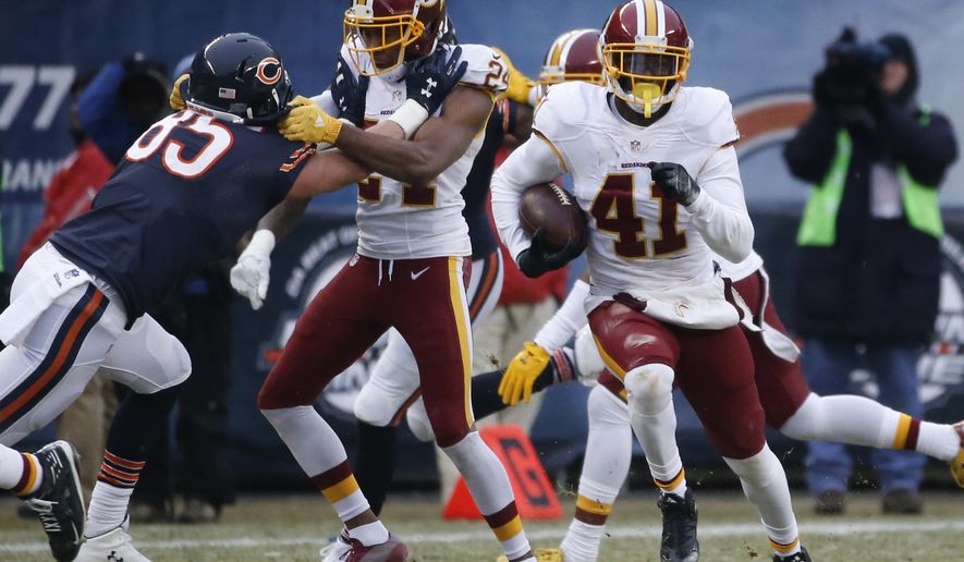 Washington Redskins free safety Will Blackmon (41) returns an interception against the Chicago Bears during the second half of an NFL football game, Saturday, Dec. 24, 2016, in Chicago. (AP Photo/Nam Y. Huh)