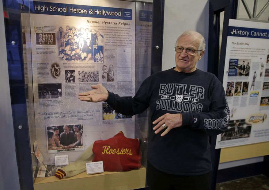 In this Tuesday, Dec. 20, 2016 photo, Bobby Plump, star of the 1954 Milan state championship basketball team featured in the movie "Hoosiers," talks about a display of movie memorabilia on display at Hinkle Fieldhouse in Indianapolis. Hinkle Fieldhouse was the site of championship game and the filming of the final game in the movie. (AP Photo/Michael Conroy)