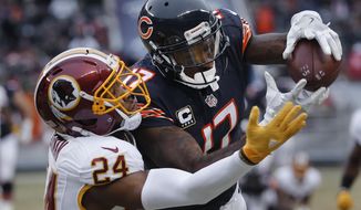 Chicago Bears wide receiver Alshon Jeffery (17) pulls in a reception as Washington Redskins cornerback Josh Norman (24) defends during the first half of an NFL football game, Saturday, Dec. 24, 2016, in Chicago. (AP Photo/Charles Rex Arbogast)