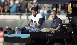 Tennessee Titans quarterback Marcus Mariota leaves the field on a cart after he was injured during the second half of an NFL football game against the Jacksonville Jaguars, Saturday, Dec. 24, 2016, in Jacksonville, Fla. (AP Photo/Phelan M. Ebenhack)