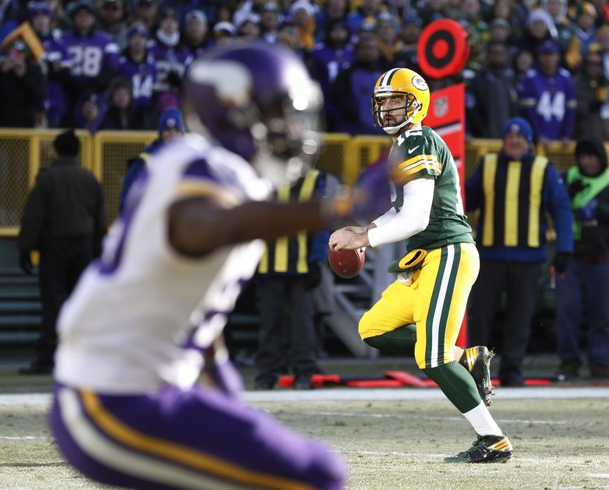 Green Bay Packers&#x27; Aaron Rodgers scrambles during the first half of an NFL football game against the Minnesota Vikings Saturday, Dec. 24, 2016, in Green Bay, Wis. (AP Photo/Matt Ludtke)
