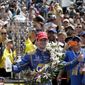 FILE - In this May 29, 2016 file photo, Alexander Rossi celebrates after winning the 100th running of the Indianapolis 500 auto race at Indianapolis Motor Speedway in Indianapolis. The race was snatched away by Alexander Rossi, a 24-year-old American competing in the race for the first time. (AP Photo/Darron Cummings, File)