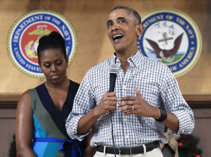 President Barack Obama, joined by first lady Michelle Obama, speaks during an event to thank service members and their families at Marine Corps Base Hawaii, in Kaneohe Bay, Hawaii, Sunday, Dec. 25, 2016. (AP Photo/Carolyn Kaster) ** FILE **