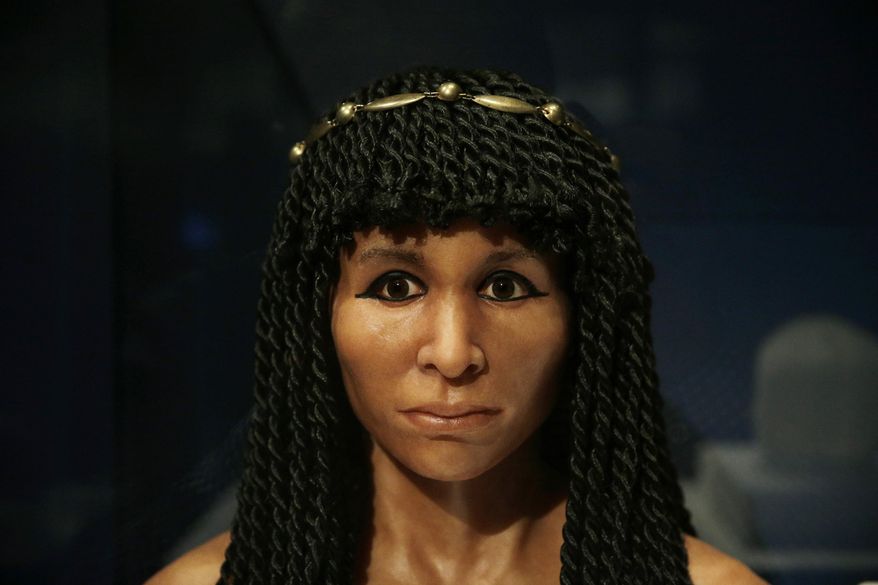 FILE - In this Sept. 10, 2015 file photo, the reconstructed face of an Egyptian mummy known as the Gilded Lady is on display at the Natural History Museum, in Los Angeles. It is part of a traveling exhibition that used CT scanning to "unwrap" ancient mummies and is an example of museums working to present exciting and meaningful exhibits by increasingly relying on technology. (AP Photo/Jae C. Hong, File)