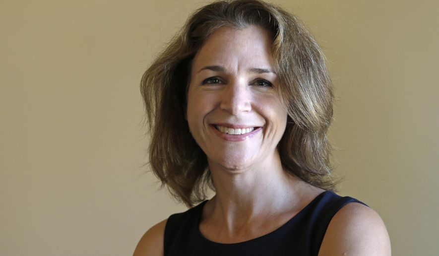 FILE - In this Sept. 14, 2016, file photo, Democrat Hilary Franz, a candidate for Washington state Commissioner of Public Lands, poses in Cle Elum, Wash. The newly elected commissioner of public lands said her top priorities after taking office will be preparing public lands to deal with climate change and to find ways to strength local rural economies. (AP Photo/Elaine Thompson, File)