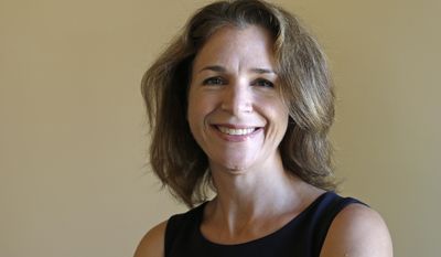 FILE - In this Sept. 14, 2016, file photo, Democrat Hilary Franz, a candidate for Washington state Commissioner of Public Lands, poses in Cle Elum, Wash. The newly elected commissioner of public lands said her top priorities after taking office will be preparing public lands to deal with climate change and to find ways to strength local rural economies. (AP Photo/Elaine Thompson, File)