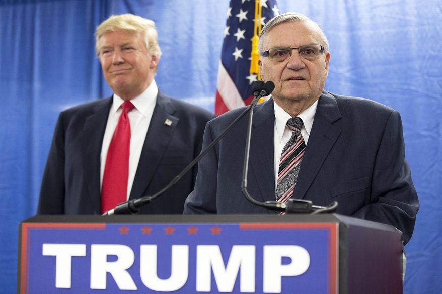 FILE - In this Jan. 26, 2016, file photo, Republican presidential candidate Donald Trump, left, is joined by Maricopa County, Ariz., Sheriff Joe Arpaio during a news conference in Marshalltown, Iowa. The longtime Maricopa County sheriff had a tough year. He was voted out of office in November, losing to Democrat Paul Penzone amid lingering frustration over his legal issues and costs. He also was charged with criminal contempt of court over his defiance of a judges orders in a racial profiling case. (AP Photo/Mary Altaffer, File)
