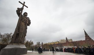 In this photo taken on Friday, Nov. 4, 2016, Russian President Vladimir Putin speaks at the unveiling ceremony of a monument to Vladimir the Great, who is credited with making Orthodox Christianity the official faith of Russia, Ukraine and Belarus, on the National Unity Day outside the Kremlin in Moscow, Russia. When Alexander Zemlianichenko started working as an AP photographer in Moscow, the Soviet Union was nearing its demise. (AP Photo/Alexander Zemlianichenko, file)