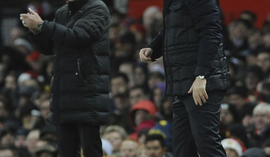 Manchester United manager Jose Mourinho, left, and Sunderland manager David Moyes watch the action during the English Premier League soccer match between Manchester United and Sunderland at Old Trafford in Manchester, England, Monday, Dec. 26, 2016. (AP Photo/Rui Vieira)