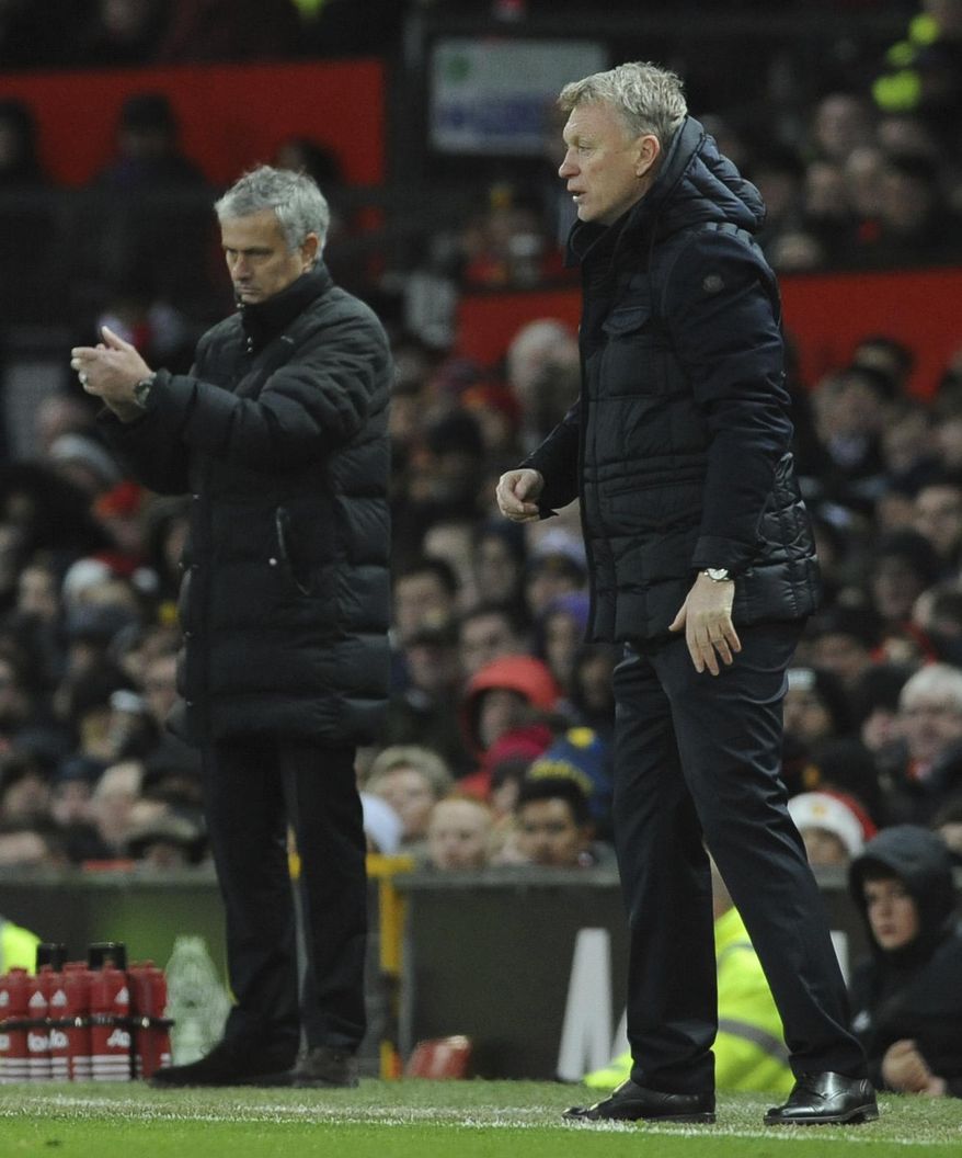 Manchester United manager Jose Mourinho, left, and Sunderland manager David Moyes watch the action during the English Premier League soccer match between Manchester United and Sunderland at Old Trafford in Manchester, England, Monday, Dec. 26, 2016. (AP Photo/Rui Vieira)