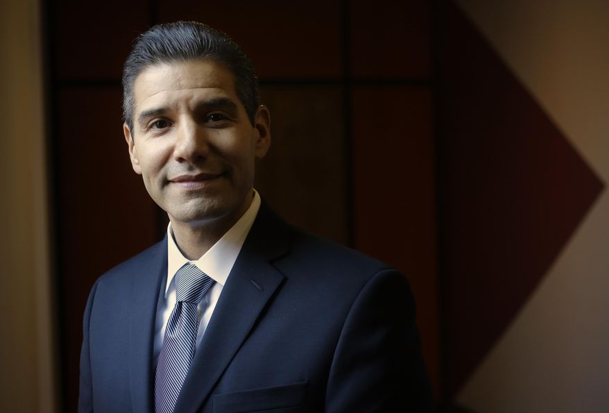 In this Nov. 22, 2016 photo John Valverde stands for a portrait at YouthBuild USA, Inc., in Somerville, Mass. In January of 2017 Valverde is to take over as CEO of YouthBuild USA, Inc., an international organization that helps young, low-income inner-city dropouts reclaim their lives. Valverde isn't your typical corporate executive: He served 16 years in prison for fatally shooting his girlfriend's rapist at point-blank range. While in prison, he did his best to redeem the time, earning two college degrees, teaching fellow inmates how to read and write, and working as an HIV/AIDS counselor. (AP Photo/Steven Senne)