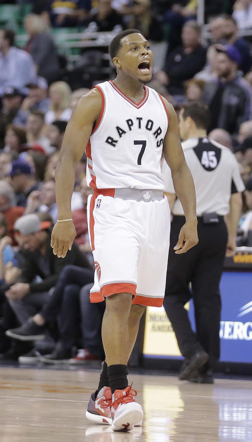 Toronto Raptors' Kyle Lowry (7) celebrates after scoring in the second half during an NBA basketball game against the Utah Jazz, Friday, Dec. 23, 2016, in Salt Lake City. The Raptors won 104-98. (AP Photo/Rick Bowmer)