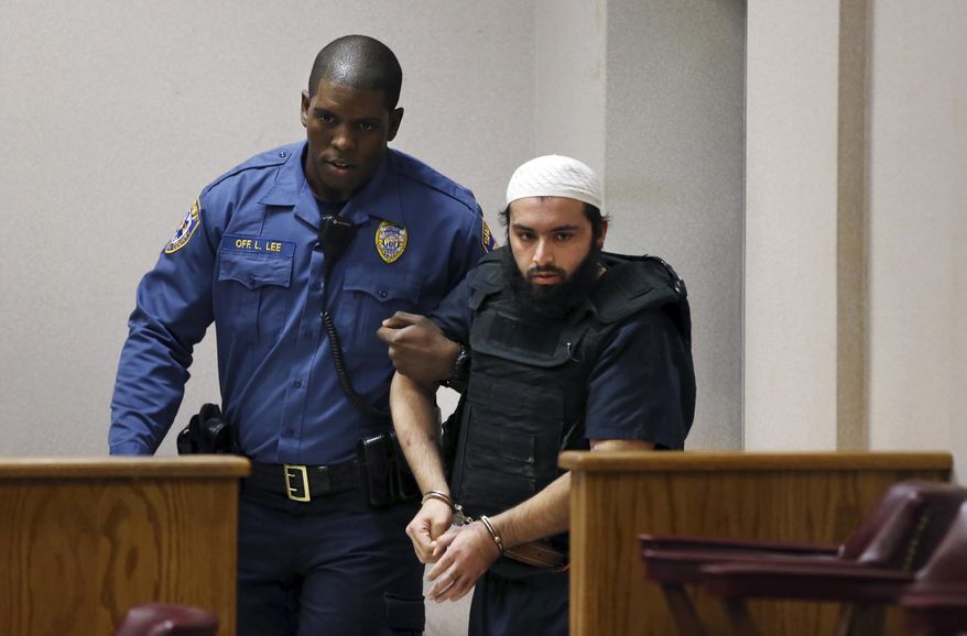 FILE - In this Tuesday, Dec. 20, 2016, file photograph, Ahmad Khan Rahimi, the man accused of setting off bombs in New Jersey and New York is led into court in Elizabeth, N.J. The Afghan-born U.S. citizen who lived with his family above a fried chicken restaurant they own in Elizabeth is now in federal custody, facing federal terror charges in both states along with attempted murder charges after prosecutors said he shot two police officers while trying to flee. (AP Photo/Mel Evans, File)