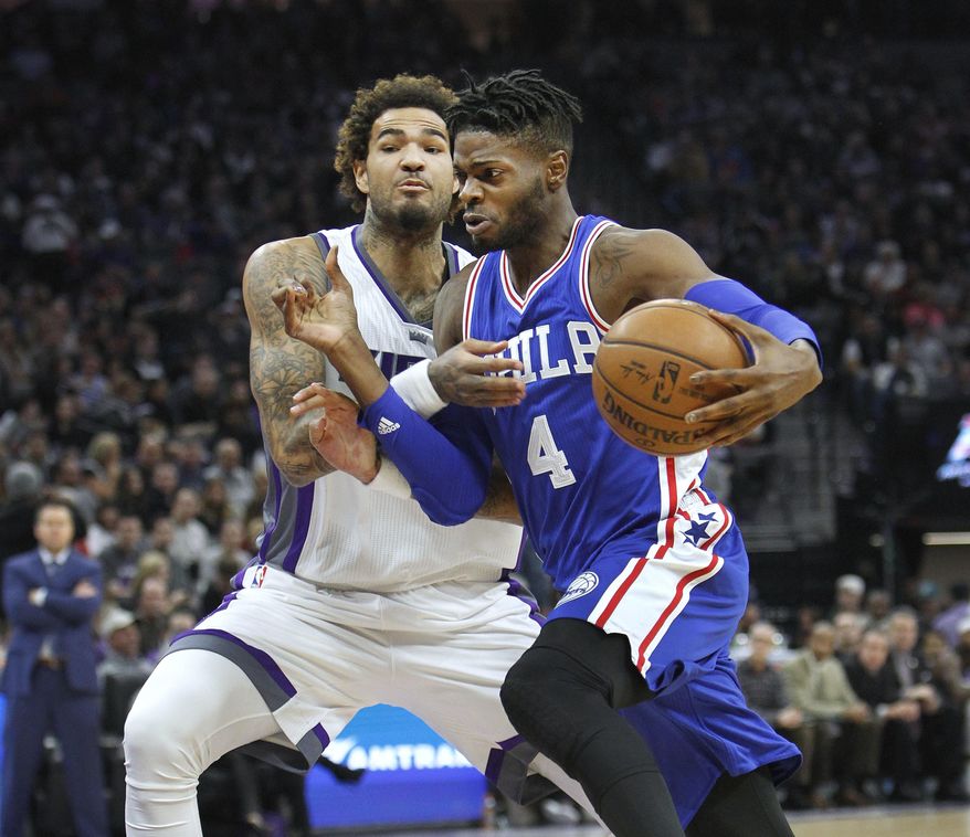 Philadelphia 76ers guard Sergio Rodriguez (4) drives past Sacramento Kings defender Willie Cauley-Stein (00)during the first half of an NBA basketball game in Sacramento, Calif., Monday, Dec. 26, 2016. (AP Photo/Steve Yeater)
