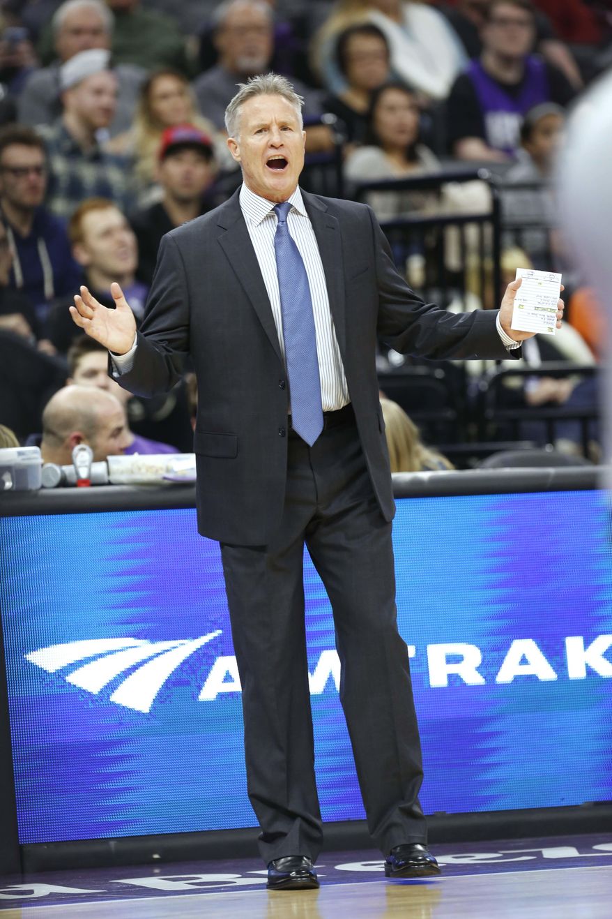 Philadelphia 76ers head coach Brett Brown directs his team against the Sacramento Kings during the first half of an NBA basketball game in Sacramento, Calif., Monday, Dec. 26, 2016. (AP Photo/Steve Yeater)