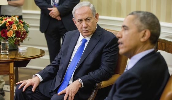 FILE -- In this Nov. 9, 2015 file photo, President Barack Obama meets with Israeli Prime Minister Benjamin Netanyahu in the Oval Office of the White House in Washington. Doubling down on its public break with the Obama administration, a furious Israeli government said, Tuesday, Dec. 27, 2016, that it has "ironclad" information from Arab sources that Washington actively helped craft last week's U.N. resolution declaring Israeli settlements illegal. The allegations further poison the increasingly toxic atmosphere between Israel and the outgoing Obama administration in the wake of Friday's vote, and raise questions about whether the White House might take further action. (AP Photo/Andrew Harnik, File)